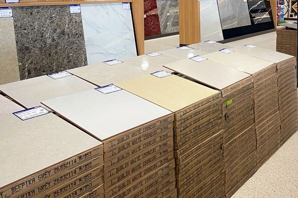 Porcelain floor tiles stacked in a builders merchant warehouse
