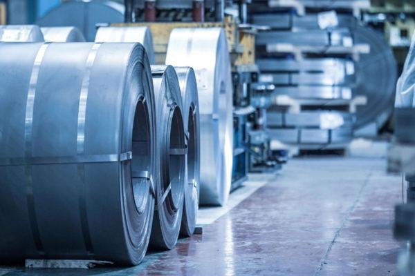 Rolls of cold-rolled steel strip in a warehouse bay
